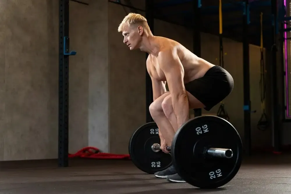 A person performing a barbell row